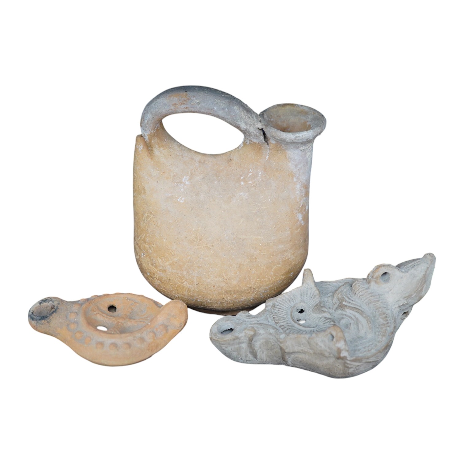 Three ancient pottery vessels, including an askos, largest 14cm high. Condition - good for age and use